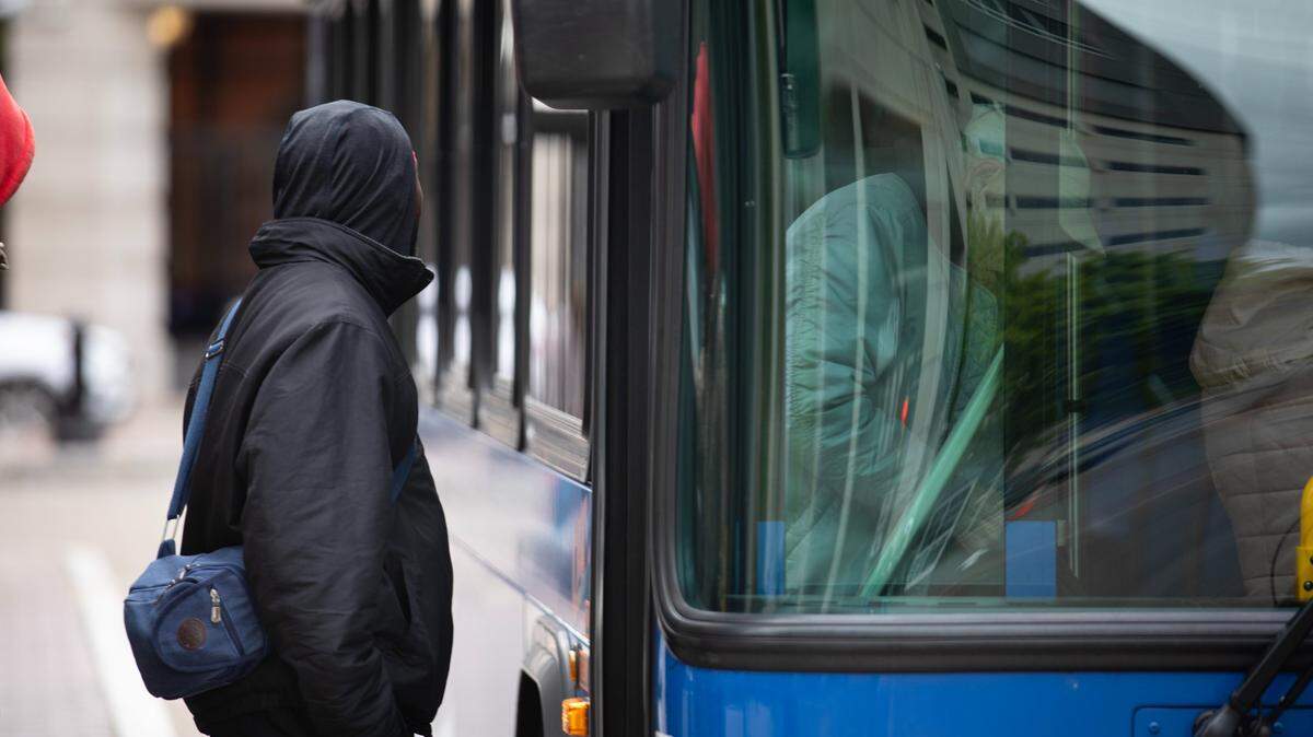 People catch a bus in Harrisburg during a commemoration of Rider Appreciation Days.