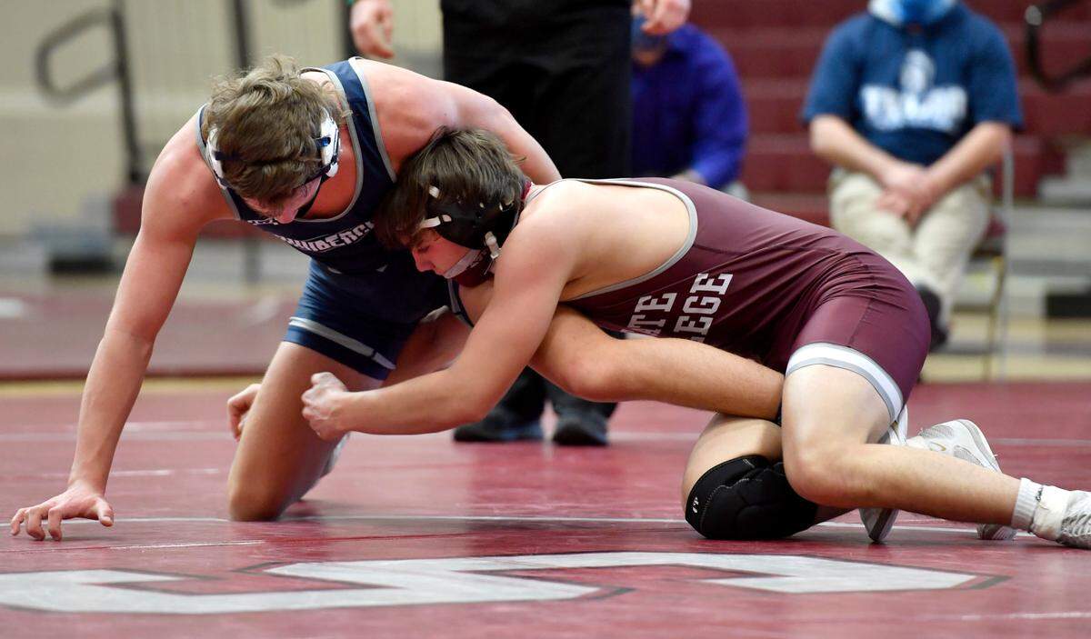 State College’s Carter Weaverling reaches for Chambersburg’s Tyler Jones in the 152 lb bout during the match on Monday, Feb. 8, 2021. Weaverling won by fall.