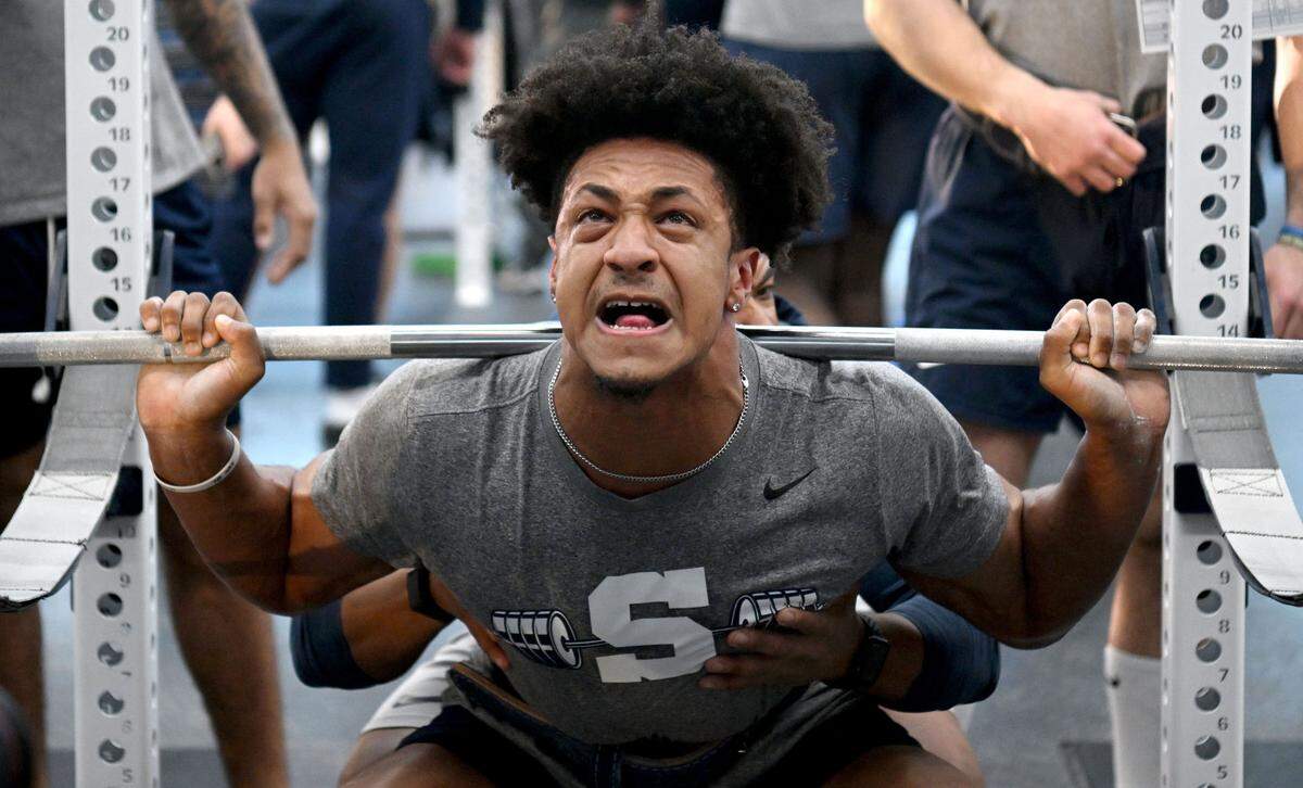 Penn State wide receiver Jason Estrella lifts during a winter workout session on Thursday, Feb. 29, 2024.