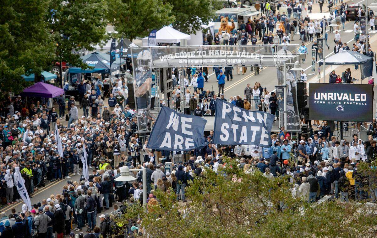 Penn State fans get pumped up the team to arrive at Beaver Stadium for the game on Saturday, Oct. 1, 2022.