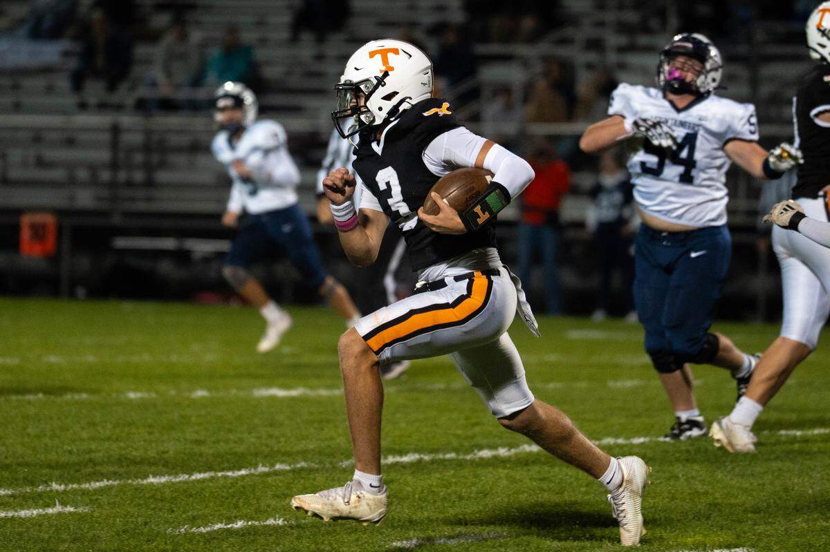 Tyrone senior Eli Woomer runs with the ball during a Friday night football game against Philipsburg-Osceola in Tyrone, Pa., on Oct. 17, 2025. The Golden Eagles beat the Mountaineers 28-7.