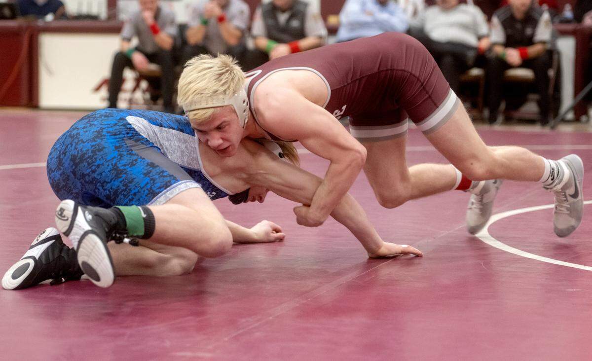 State College’s Pierson Manville wrestles Central Mountain’s Dalton Perry.in the 139 lb championship bout of the District 6 3A championships on Saturday, Feb. 18, 2023.