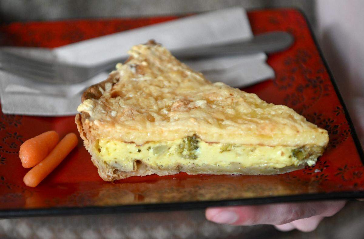 A slice of quiche featuring broccoli, bell peppers and leeks is pictured at Cafe Lemont on Wednesday, June 14, 2023.