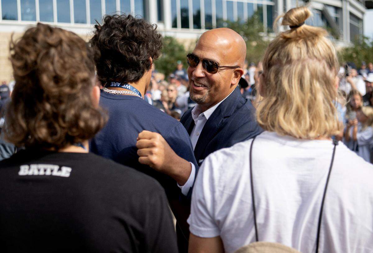Penn State football coach James Franklin greets recruits as he and the team team arrive at Beaver Stadium for the home opener against Ohio on Saturday, Sept. 10, 2022.