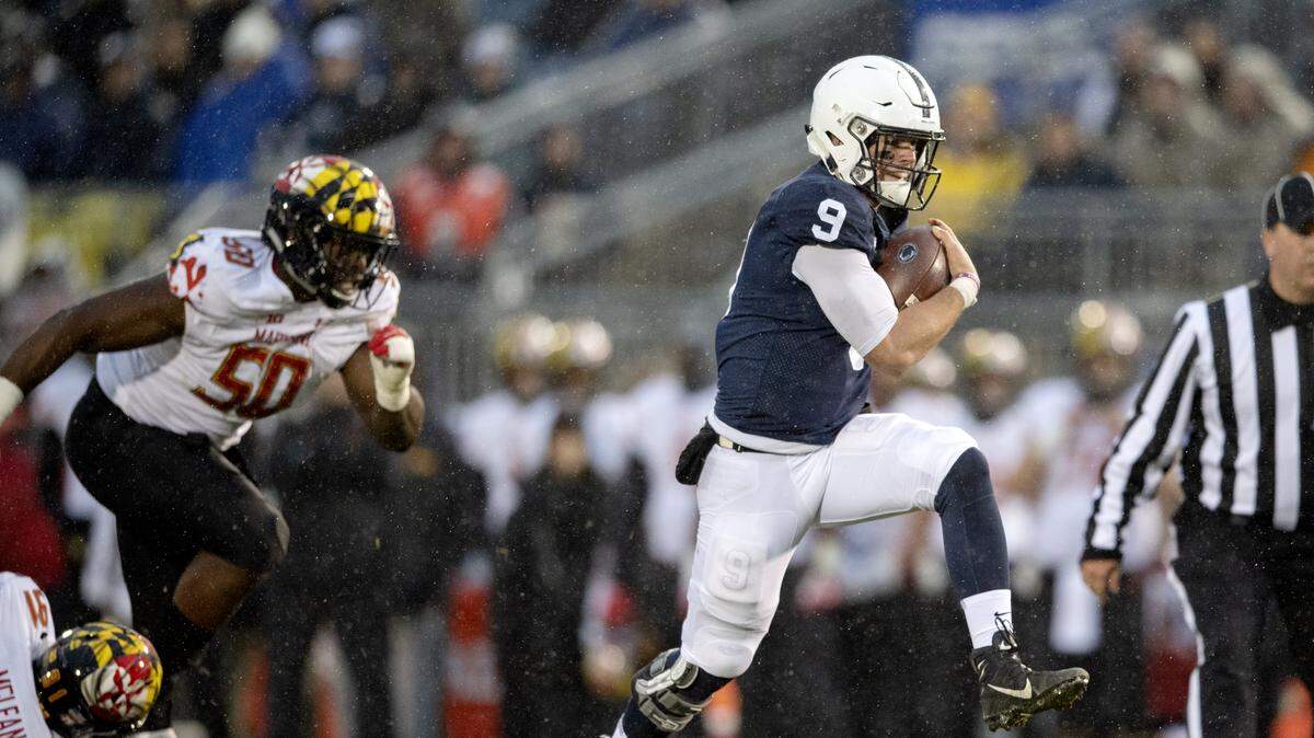 Penn State quarterback Trace McSorley runs to the end zone for a touchdown in the first quarter of the game against Maryland on Saturday, Nov.  24, 2018.  