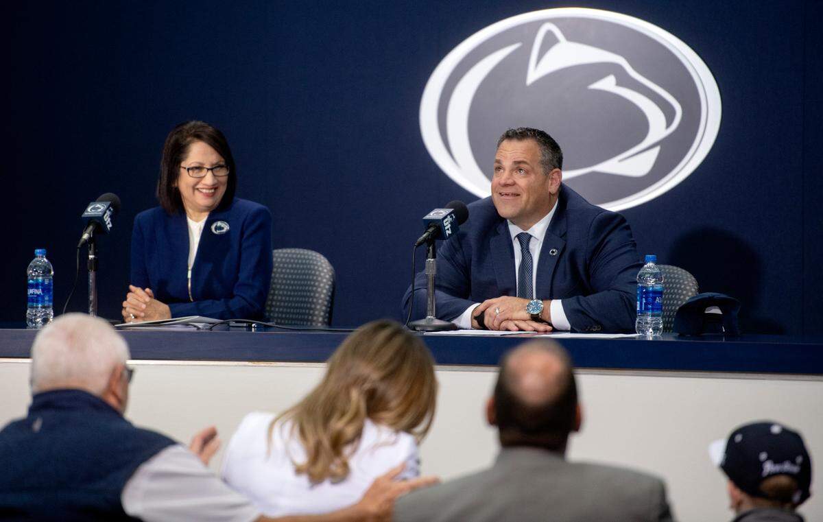 Patrick Kraft gets emotional and avoids eye contact with his wife Betsy as he thanks his family on Friday during his introductory press conference as the next Penn State athletic director.