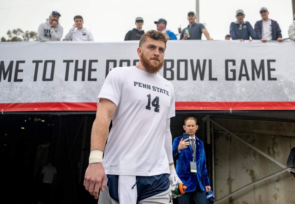 Penn State quarterback Sean Clifford walks onto the field at the Rose Bowl Stadium for initial warm ups before the game against Utah on Monday, Jan. 2, 2023.