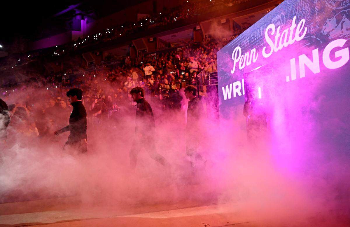 The Penn State wrestling team runs out for their match against Rutgers on Monday, February. 12, 2024 at the Bryce Jordan Center.
