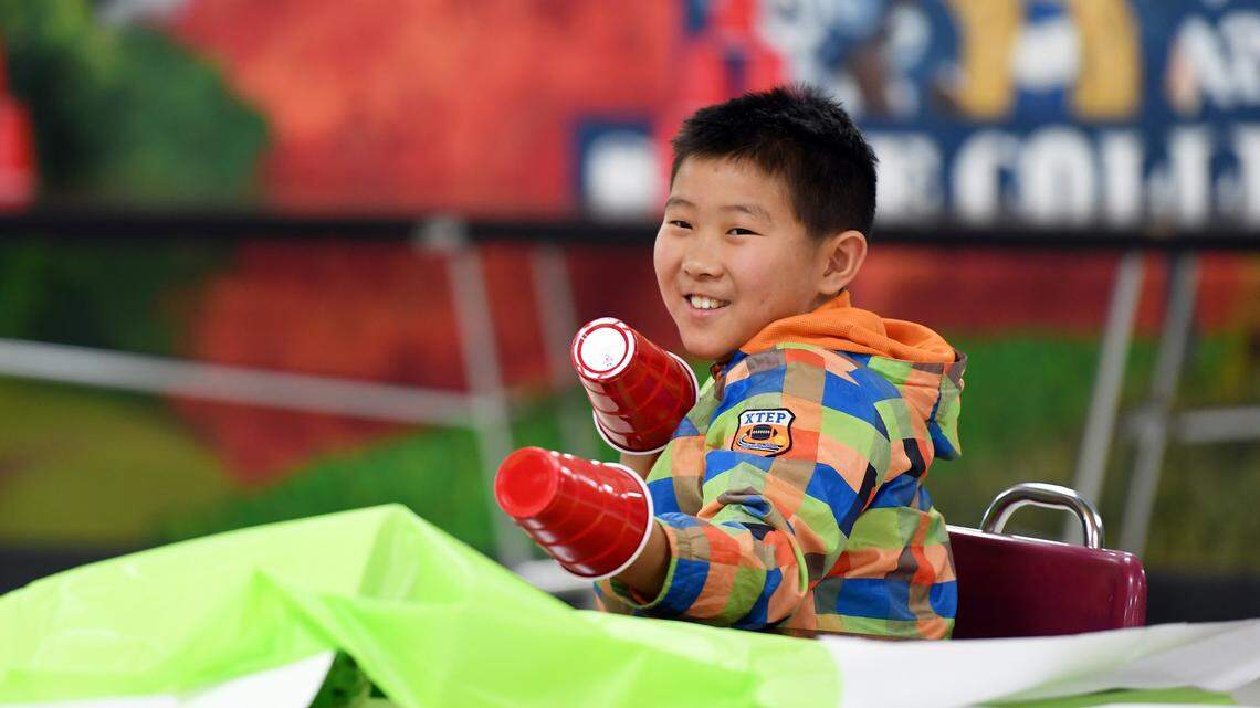 Terry Yu, 11, jokes around during the minute to win it activities during the Jana Marie Foundation event Saturday, April 14, 2018 at Park Forest Middle School.