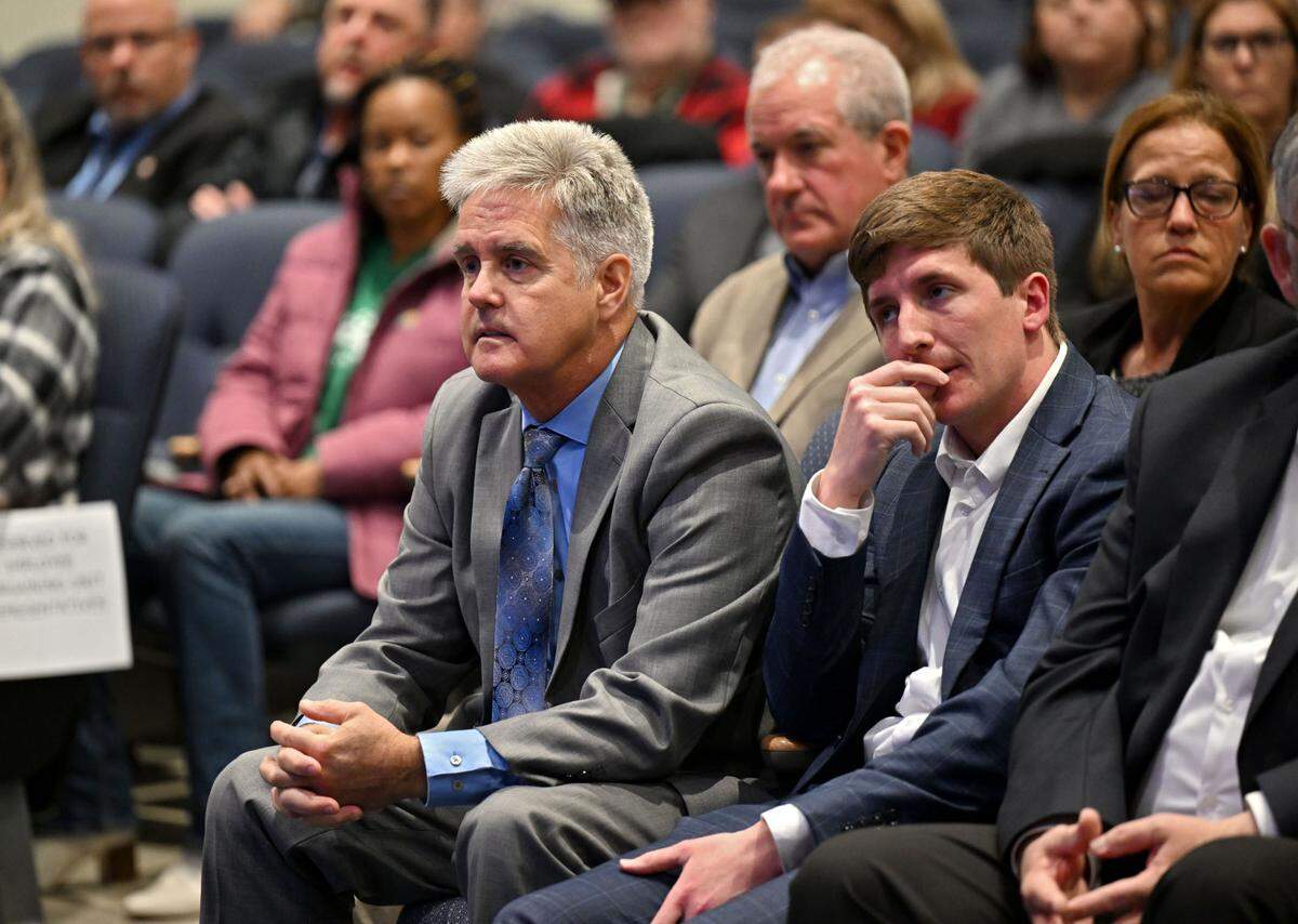 State Reps. Scott Conklin, D-Rush Township, and Dallas Kephart, R-Clearfield/Cambria, listen during the Pennsylvania Department of Corrections public hearing on the proposed closure of Rockview state prison on Tuesday, April 15, 2025, in the auditorium of Bald Eagle Area High School/Middle School.