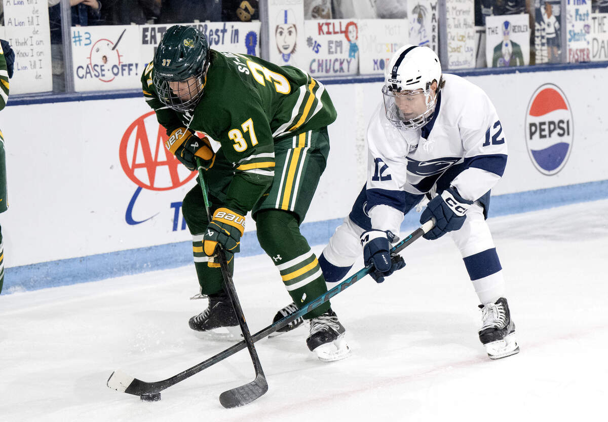 Penn State's Ben Schoen fights of the puck with Clarksons’ Mael St-Denis during the game on Thursday, Oct. 9, 2025.  Clarkson won, 6-4.