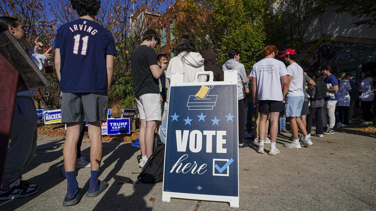 People wait in line to vote Nov. 5, 2024, at the Banana Factory in Bethlehem, Pa.