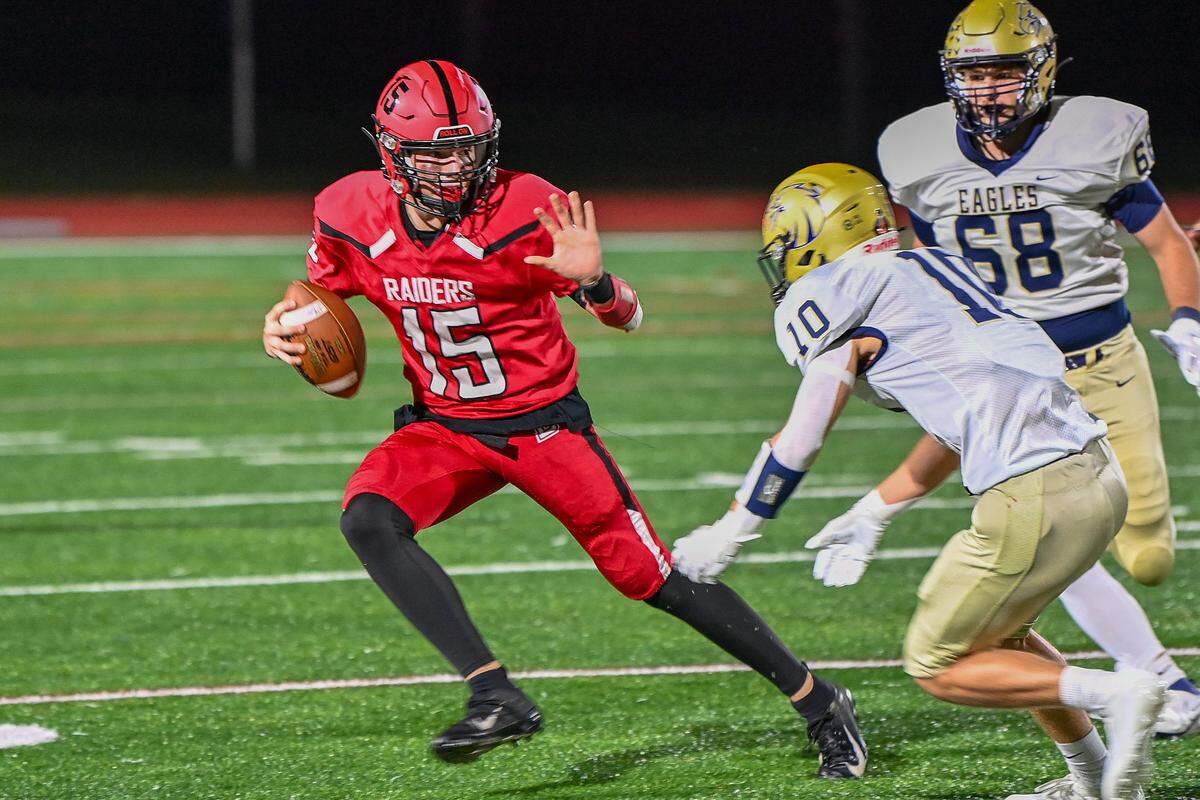 Bellefonte’s Liam Halterman stiff arms Bald Eagle Area’s Mason Reese during a game on Friday, Sept. 29, 2023.
