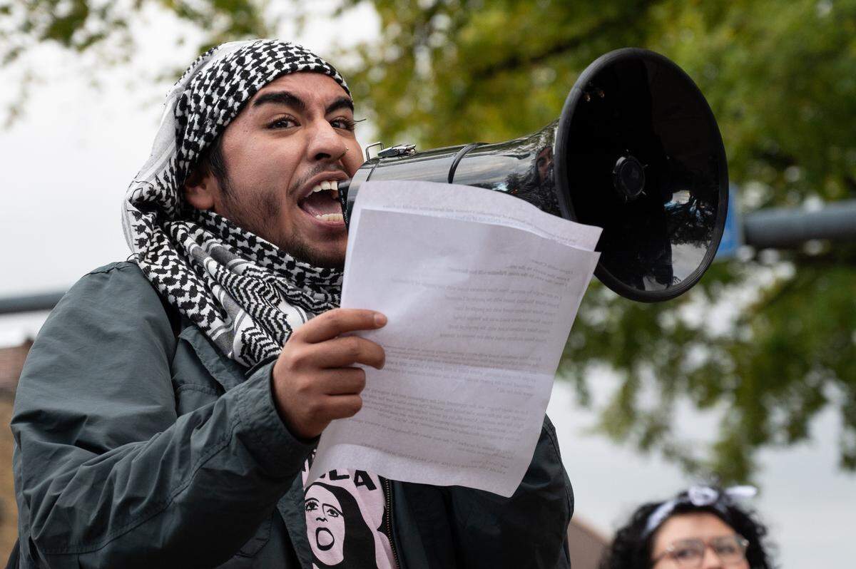 A protest leader gives a speech during a protest for the anniversary of the Israel-Hamas War at the Allen Street Gates on Monday, Oct. 7, 2024.