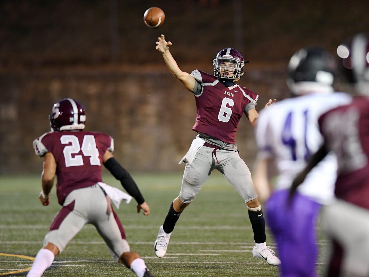 State College quarterback Jaden Seider throws a pass against Mifflin County Friday, Aug. 24, 2018 at Memorial Field. The second phase of the Memorial Field renovations have been pushed back due to all the activity with the high school and elementary school construction.