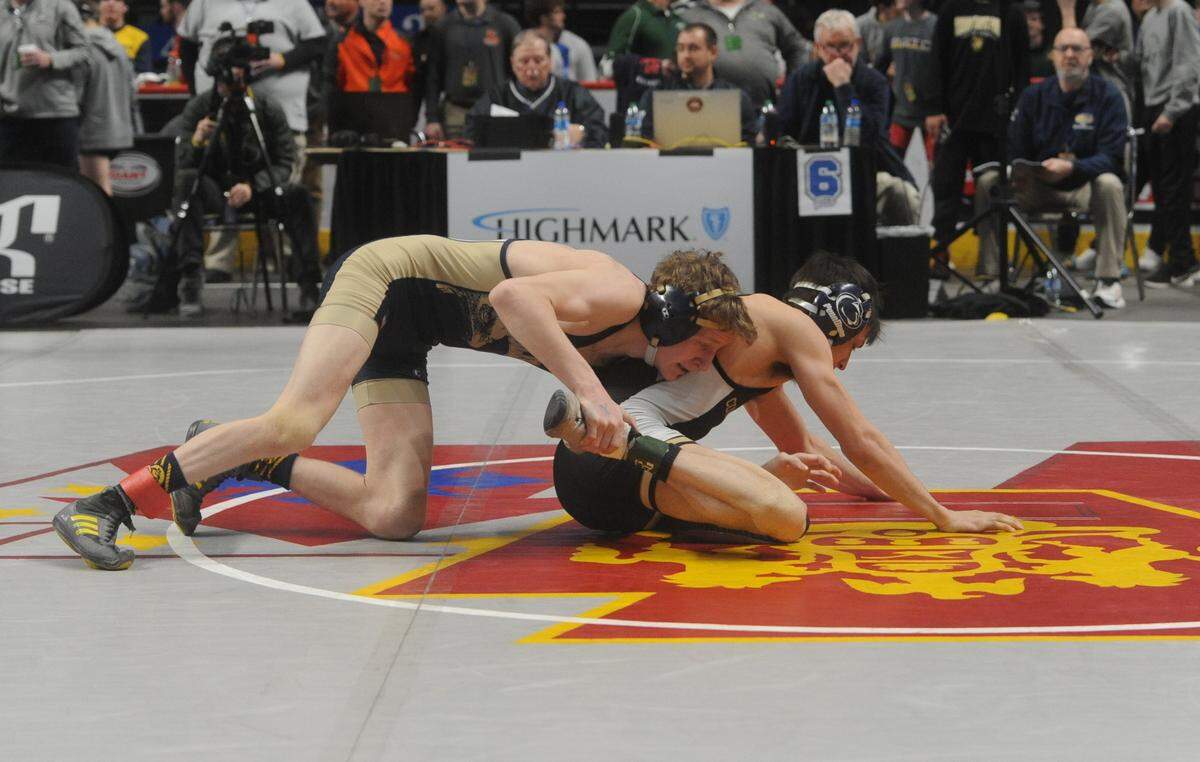 Bald Eagle Area’s Lucas Fye controls Curwensville’s Jake Carfley in their 113-pound second round match of the PIAA Class 2A Championships on Thursday, March 10, 2022 at Giant Center in Hershey. Fye pinned Carfley in 3:55.