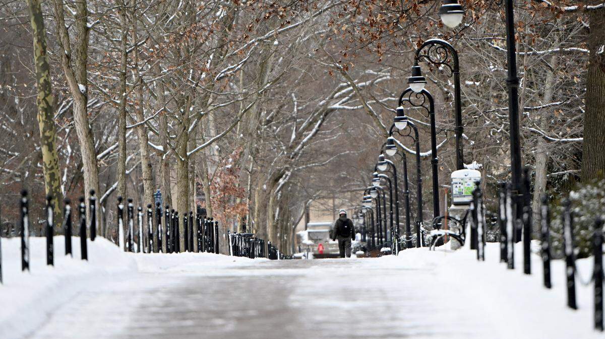 People all on the Penn State campus after several inches of snow on Tuesday, Jan. 16, 2024.