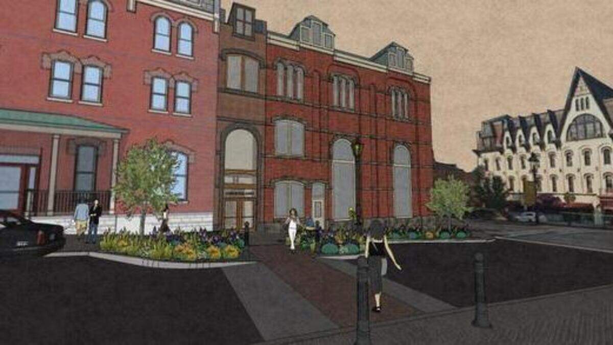 The Centre County commissioners on Tuesday approved a $1.3 million bid for a four-story building to connect the Courthouse Annex with the Temple Building in downtown Bellefonte.
