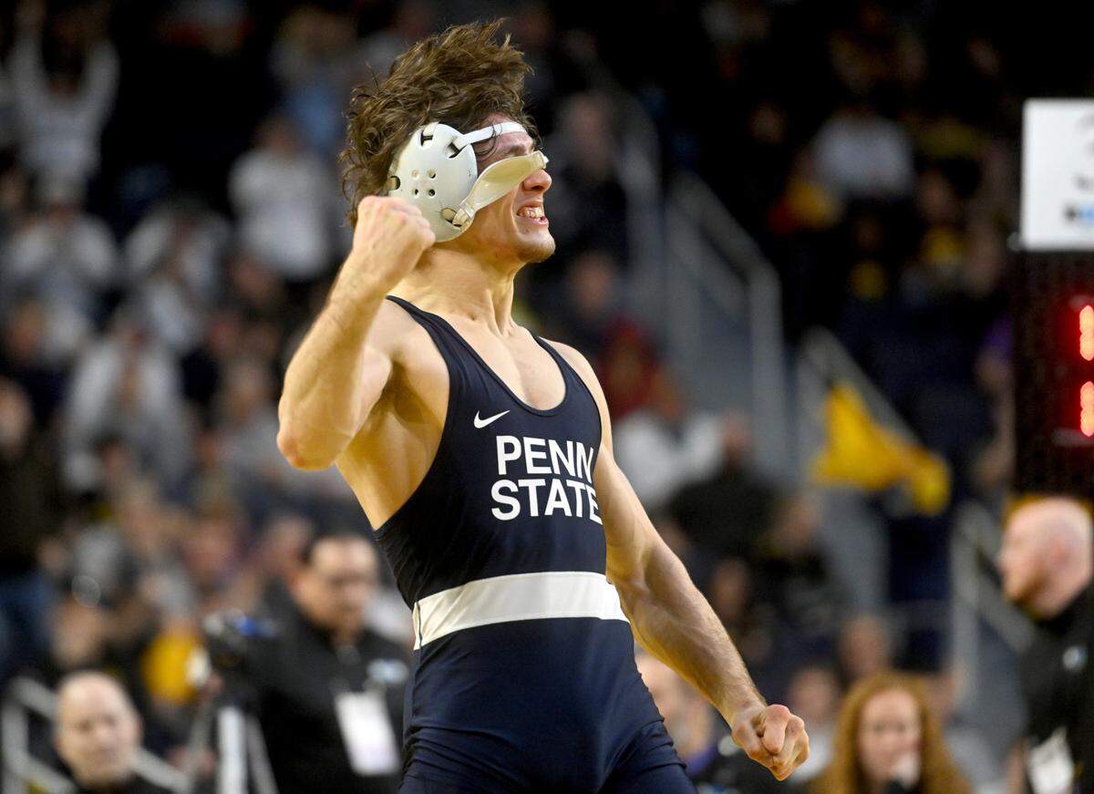 Penn State’s Levi Haines celebrates his sudden victory win over Nebraska’s Peyton Robb in the 157 lb championship bout of the Big Ten wrestling championships at the Crisler Center on Sunday, March 5, 2023.