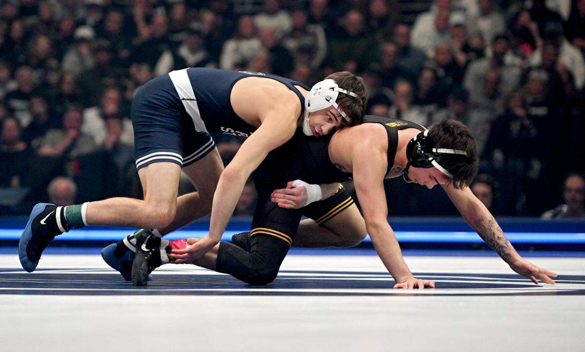 Penn State’s Luke Lilledahl controls Iowa’s Joey Cruz in the 125-pound bout of the match on Friday, Jan. 31, 2025 at the Bryce Jordan Center. Lilledahl won by tech fall.