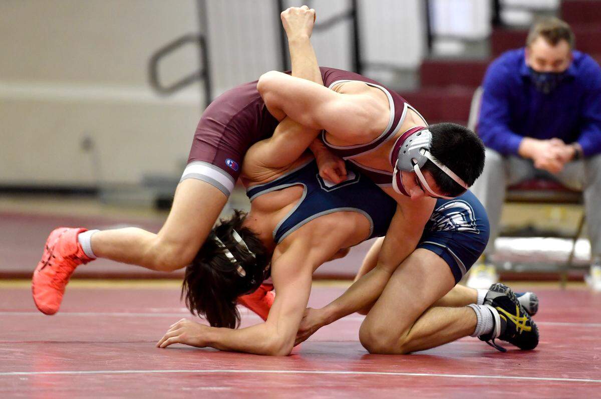 State College’s Owen Woolcott controls Chambersburg’s Luke Mentzer in the 126 lb bout during the match on Monday, Feb. 8, 2021. Woolcott won by tech fall, giving him his 100th career win.