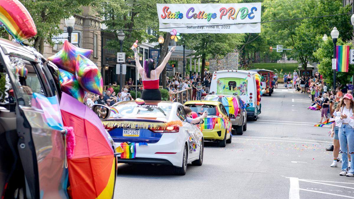 Community members line Allen Street for the State College “Pride Ride” parade on Saturday, June 11, 2022.