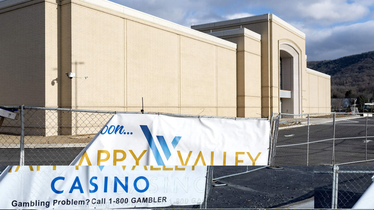 A sign promoting the Happy Valley Casino hangs on a fence of the property Dec. 30, 2025. The casino is set to open its doors in April.
