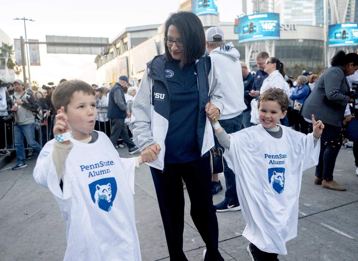 Penn State President Neeli Bendapudi dances with young fans at the pep rally hosted by the Penn State Alumni Association on Sunday, Jan. 1, 2023 at LA Live.