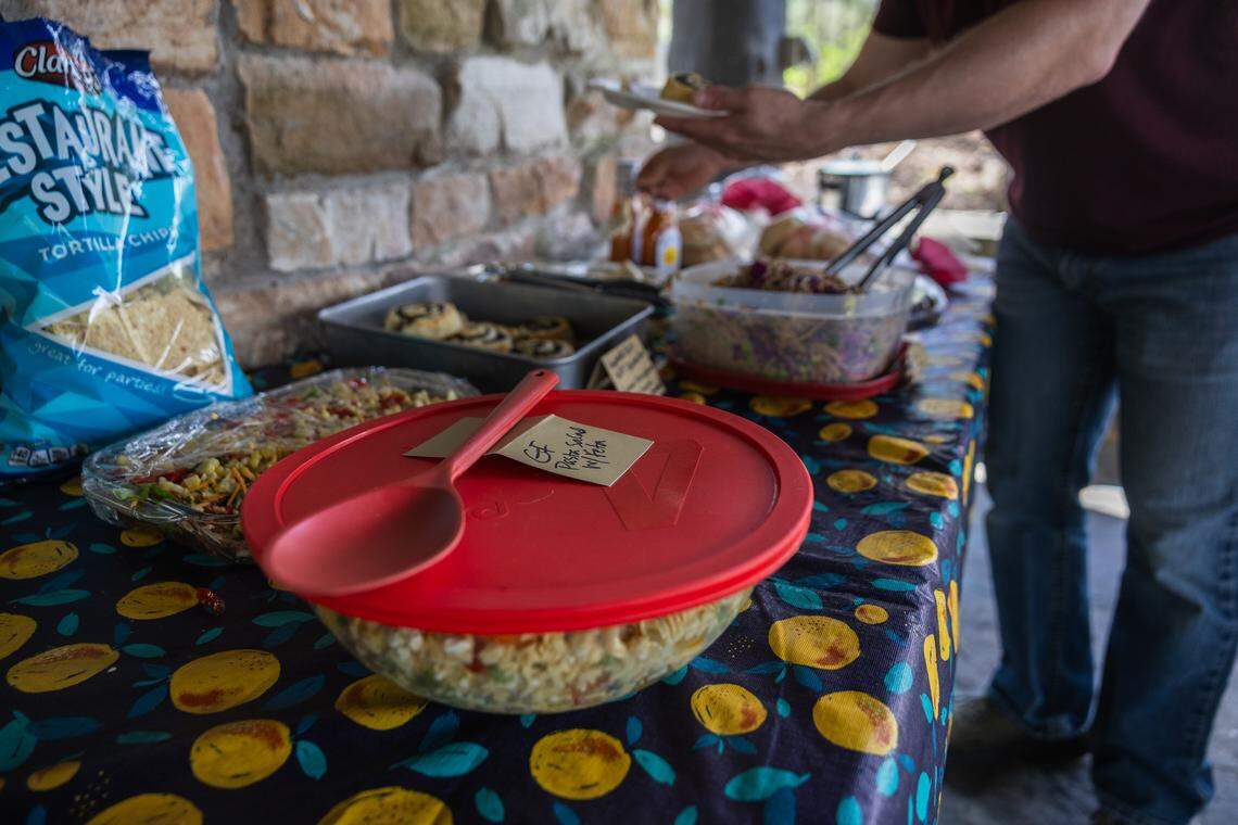 Volunteers gather for a potluck at Whipple Dam State Park in Petersburg, Pa., on Saturday, April 18, 2026, after a day of collecting trash. The ClearWater Conservancy organized volunteers across Centre County to clean up public green spaces.
