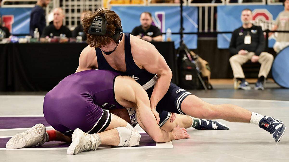 Penn State’s Tyler Kasak fights off a shot attempt from Northwestern’s Trevor Chumbley in their 157-pound quarterfinals match of the Big Ten Championships on March 8 inside Welsh Ryan Arena in Evanston, Ill. Kasak defeated Chumbley, 7-3.