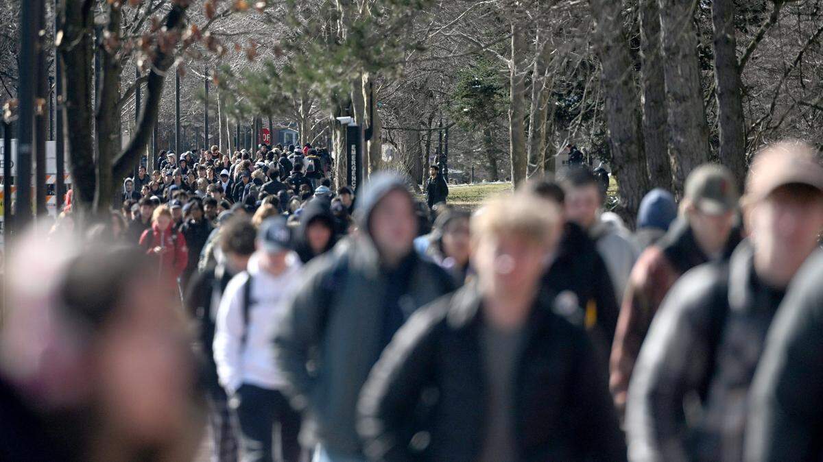 Penn State students walk along Pollock Road on the University Park campus on Wednesday, Feb. 14, 2024.