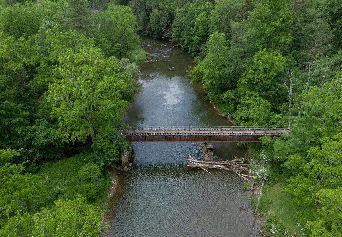 An aerial view of the footbridge that goes over Penns Creek off of Tunnel Road in Coburn which is in need of repairs. The bridge is used frequently by anglers, but also for search and rescue situations.