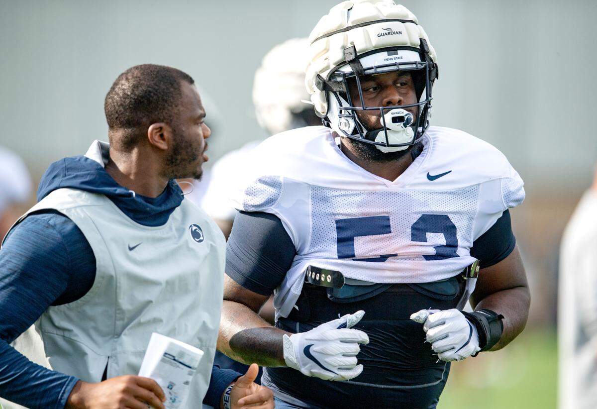 Penn State defensive tackle Fred Hansard jogs during practice on Wednesday, Aug. 11, 2021.