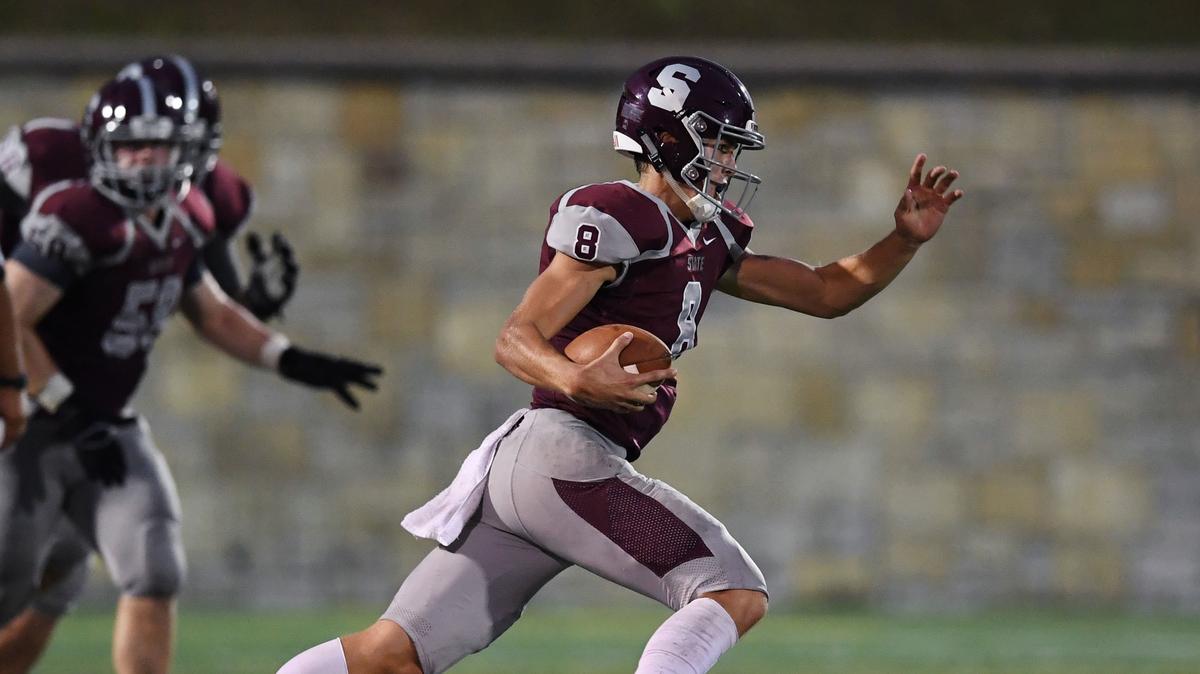 State College quarterback Tommy Friberg runs downfield against Carlisle Friday, Sept. 14, 2018 at Memorial Field.