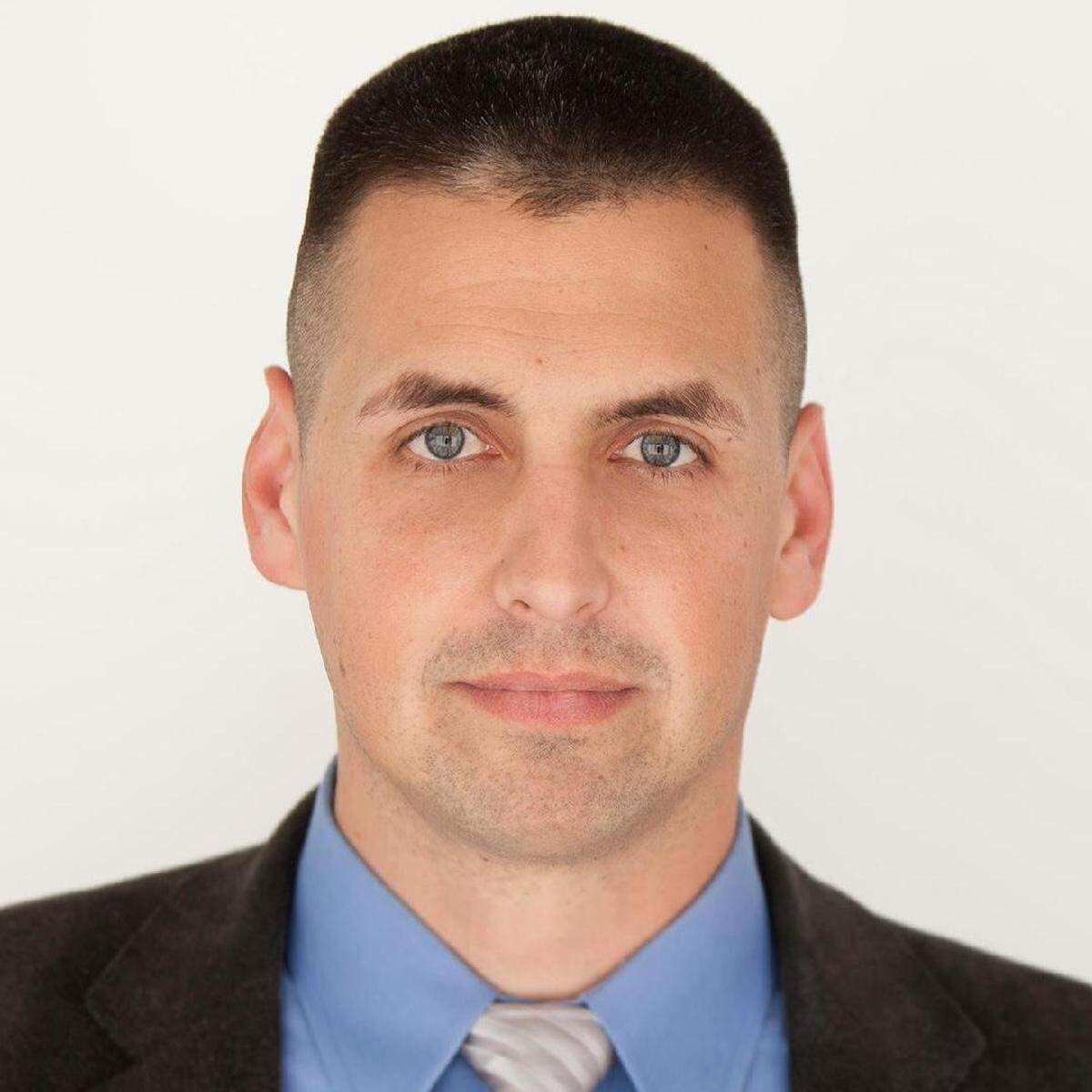 Justin L. Magill