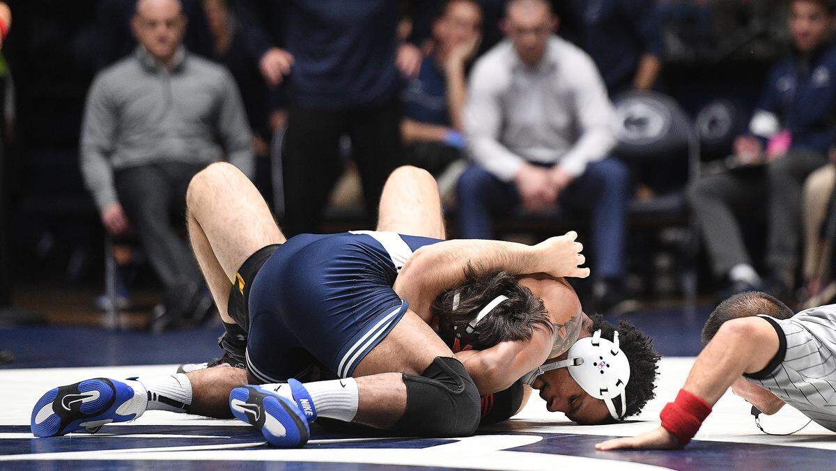 Penn State’s Mark Hall (top) pins Maryland’s Philip Spadafora in 21 seconds during Sunday’s meet at Rec. Hall. Penn State defeated Maryland, 40-3. (For the CDT/Steve Manuel)