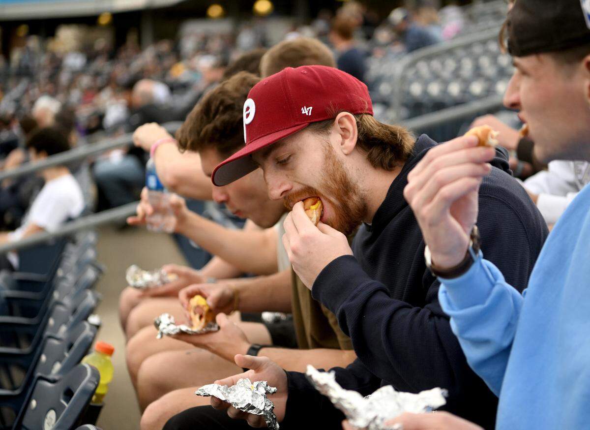 Max Steel and his friends enjoy dollar dog night at the Penn State baseball game on Tuesday, April 11, 2023 at Medlar Field.