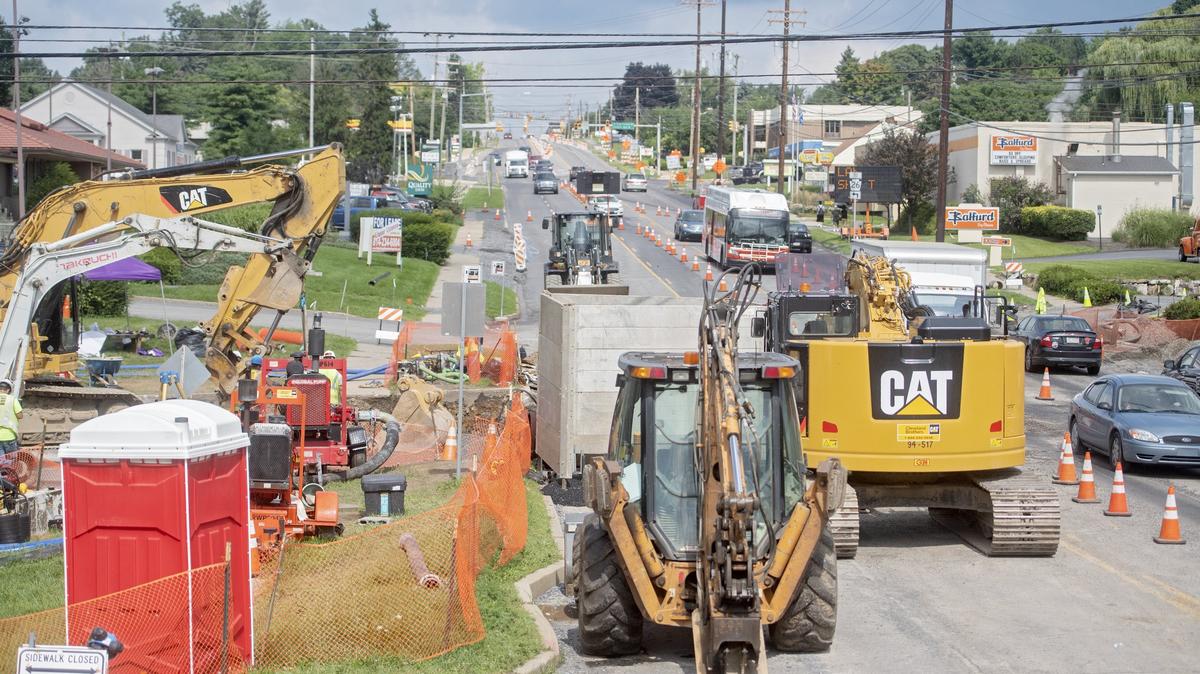 Traffic is shifted as work continues on the sewer line relocation across the 1200 block of North Atherton Street.