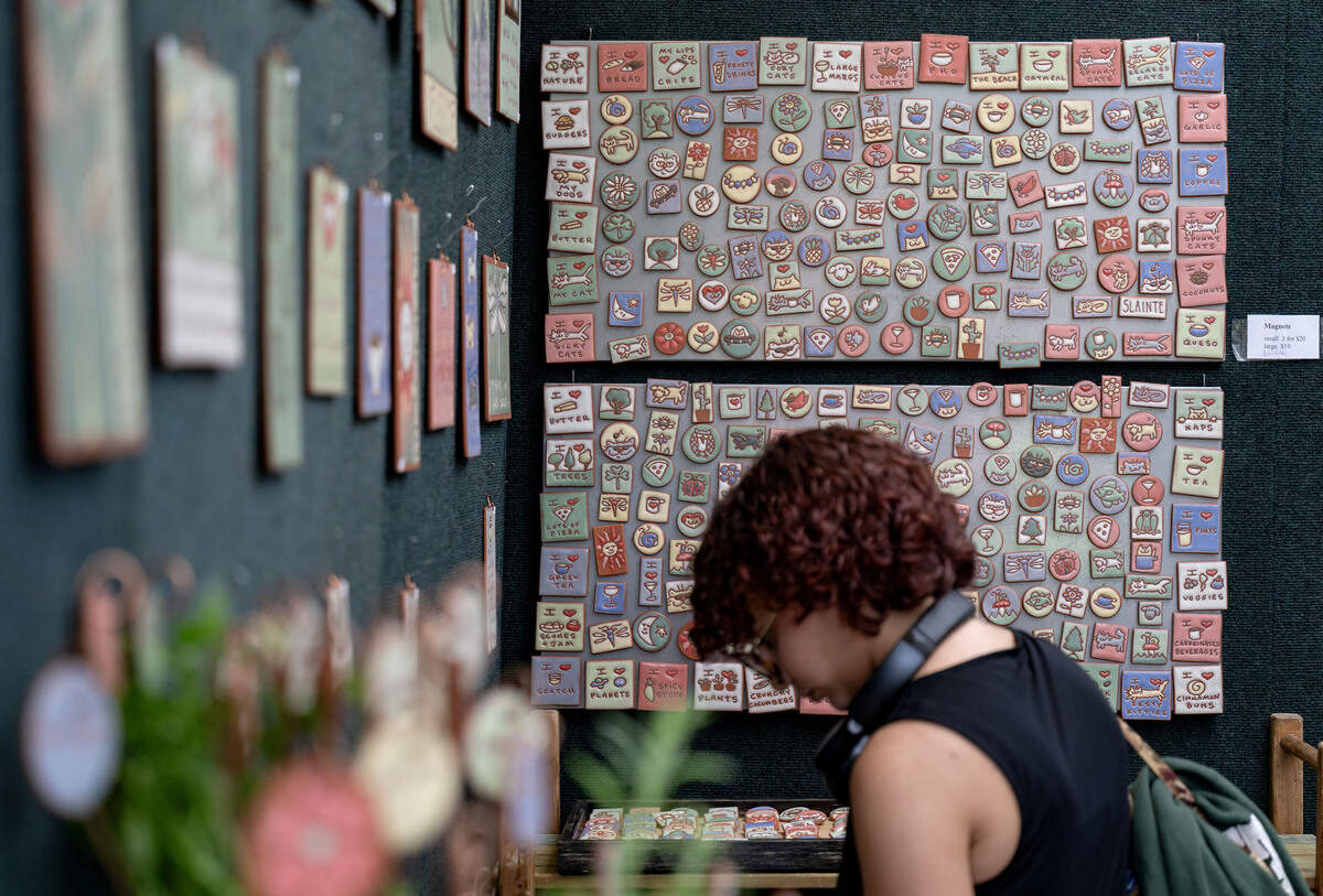 Whimsical magnets hand painted by Kate Lally in her booth at the Central Pennsylvania Festival of the Arts on Friday, July 10, 2026.