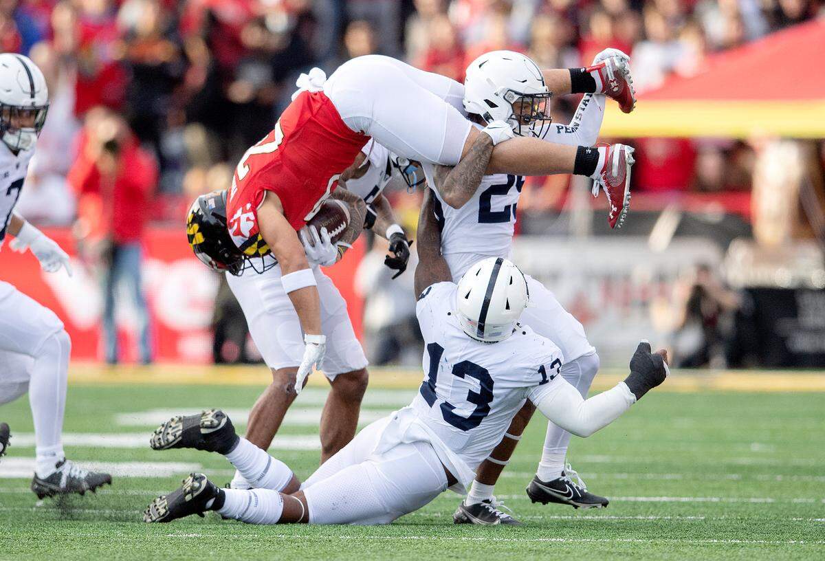 Penn State cornerback Daequan Hardy stops Maryland running back Challen Faamatau as he tries to leap over him during the game on Saturday, Nov. 6, 2021.