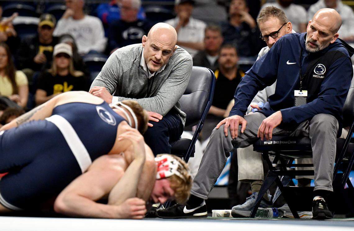 Penn State wrestling coaches Cael Sanderson and Casey Cunningham yell to Josh Barr during his 197-pound championship bout at the Big Ten Wrestling Championships on Sunday, March 8, 2026.  