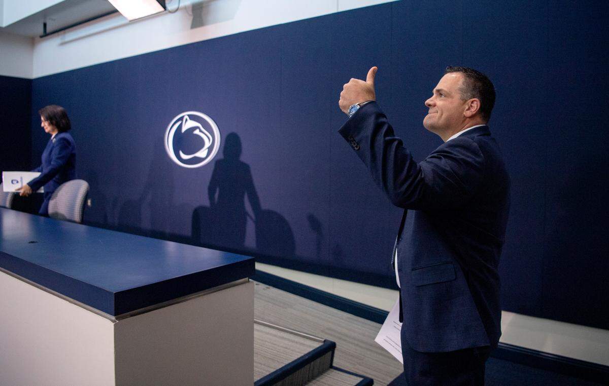 Incoming Penn State Athletic Director Patrick Kraft gives a thumbs-up to coaches on Friday as walks in for his introductory press conference.