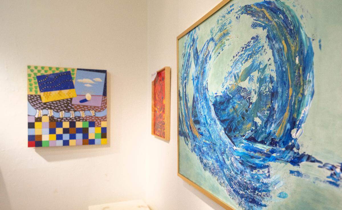 A piece by a current member of the The Art Alliance of Central Pennsylvania hangs with art by Deanna Blumenthal. The Art Alliance is having an exhibit to celebrate their 55th anniversary and honor founder Deanna Blumenthal.