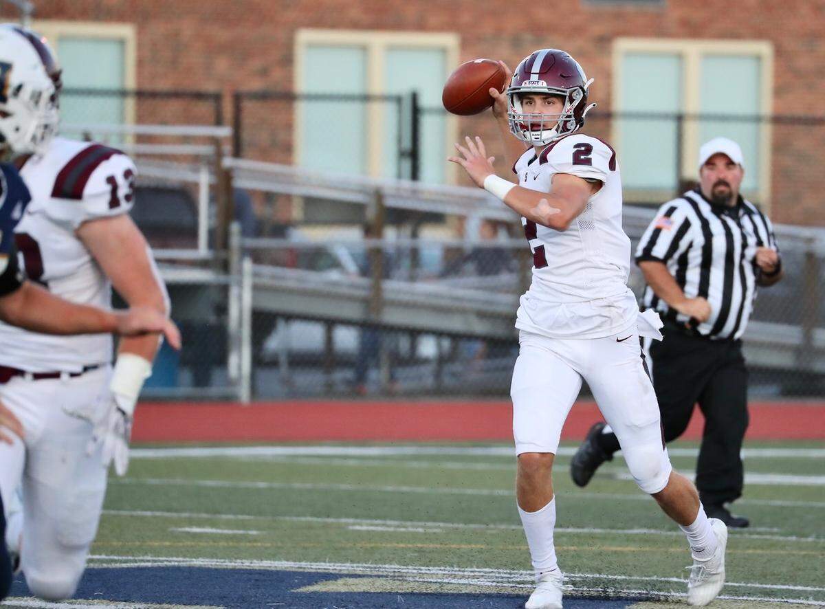 State College’s Finn Furmanek looks to make a pass against Hollidaysburg on Friday, Sept. 10, 2021. State College won, 34-20.