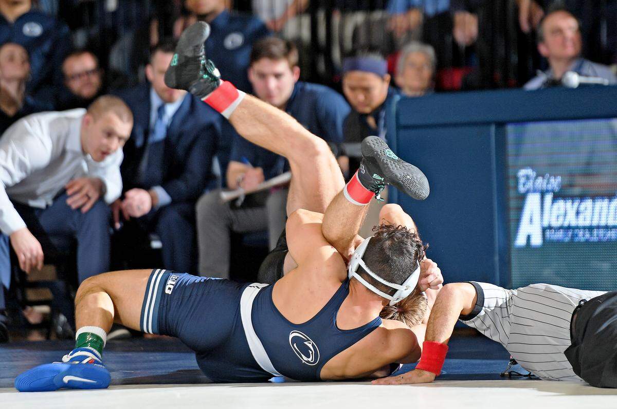 Penn State’s Vincenzo Joseph pins Northwestern’s Shayne Oster during Sunday’s match at Rec. Hall. Penn State defeated Northwestern 30-9. (For the CDT/Steve Manuel)