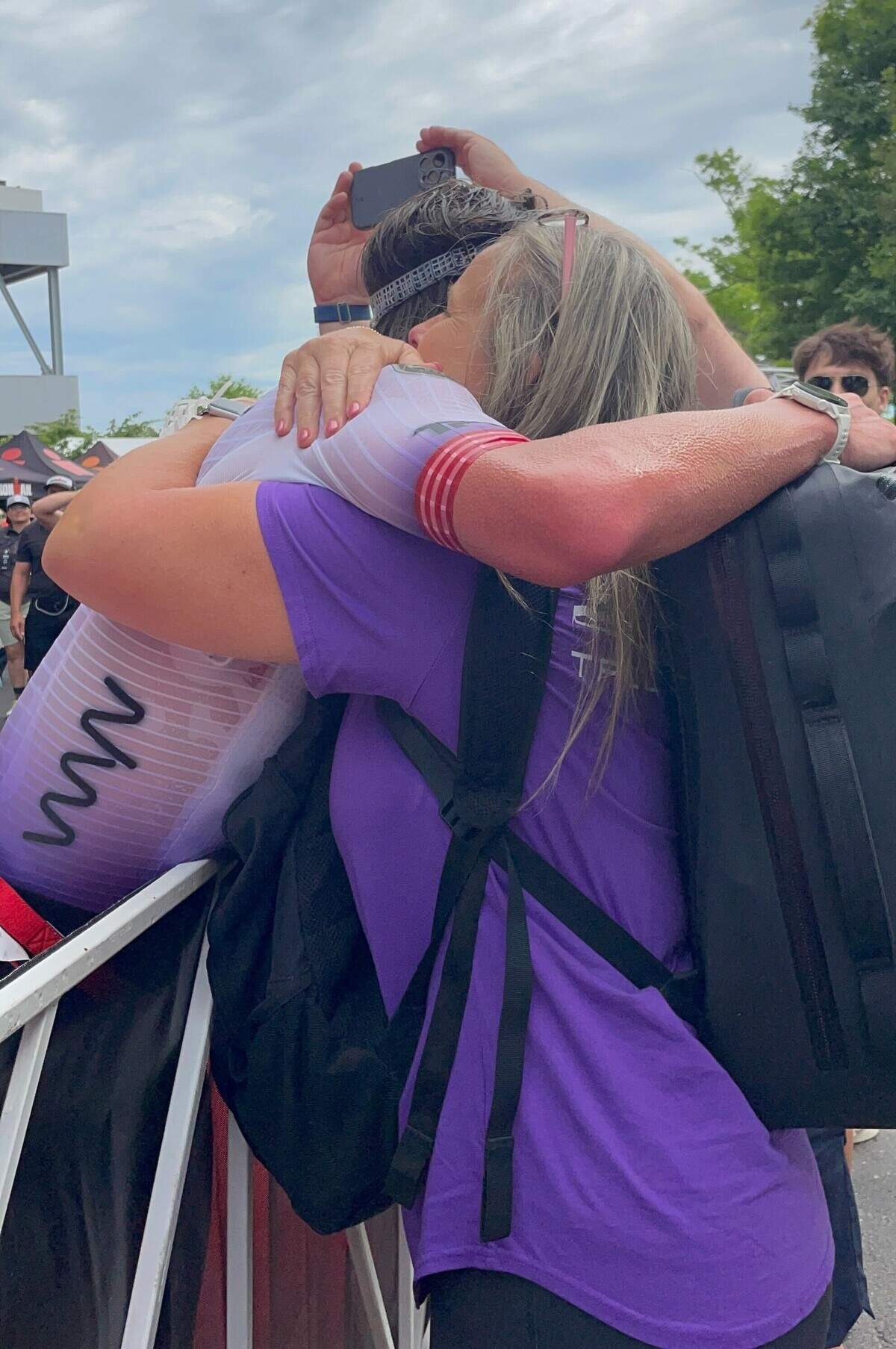 Trevor Foley hugs his mother, Shannon, after placing first Sunday, June 14, 2026, at the Ironman 70.3 Pennsylvania Happy Valley North American Championship in Centre and Clinton counties.