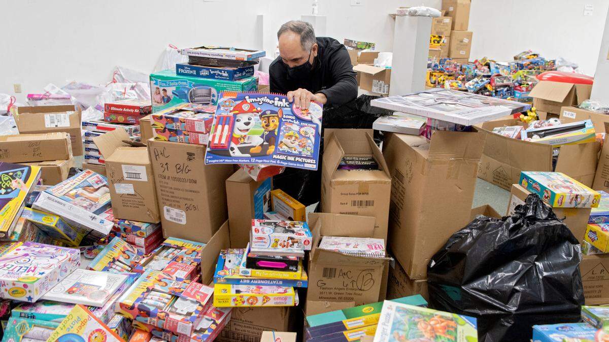 Paul DeCusati helps sort toys Tuesday at the Toys for Tots Unregistered Site, where hundreds of toys are still available for area children.