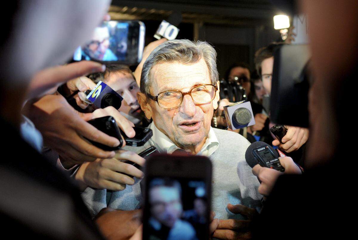 Penn State football coach Joe Paterno talks to the media and crowd of students who gathered outside of his home on Tuesday, Nov. 8, 2011.