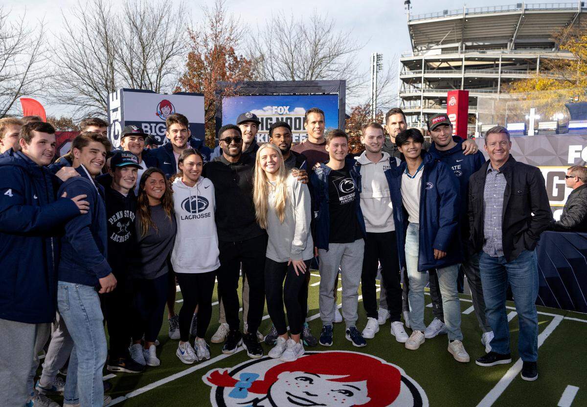 Penn State athletes pose with the Fox “Big Noon Kickoff” hosts on the set on Friday, Oct. 28, 2022.