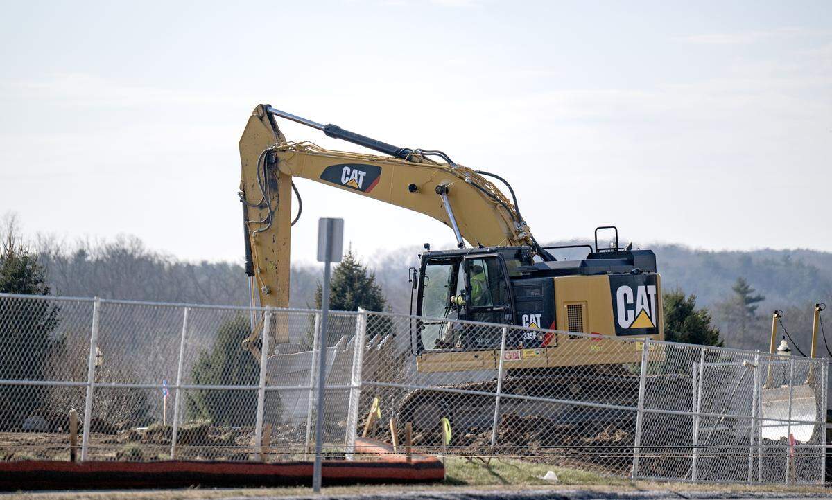 Construction crews work on the site of the Wawa along the Benner Pike on Thursday, Dec. 18, 2025.  